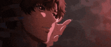 a close up of a person 's face with their finger pointing at something