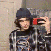 a man taking a picture of himself in a mirror