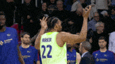 a basketball player with the name parker on the back of his shirt