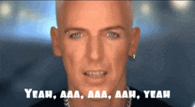 a close up of a man 's face with the words yeah aaa aaa aah yeah on the bottom