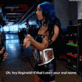 a woman with blue hair is wearing a wwe belt