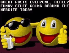 two pac man smiley faces wearing sunglasses and holding a cup of milk are giving a thumbs up .