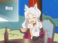 a fox girl is sitting at a table holding a cup of coffee and a bottle of alcohol .