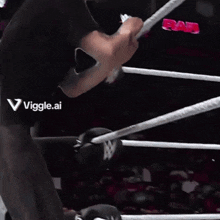 a man in a black shirt with the word viggle on the back
