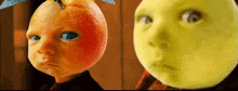 a baby with an orange head next to a baby with a yellow face