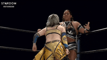 two women wrestling in a ring with the word stardom on the bottom right