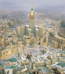an aerial view of a city with a clock tower