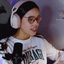 a woman wearing headphones and a drag shirt