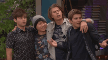 a group of young men are standing next to each other and one of them is wearing a shirt that says chicago .