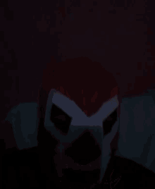 a person wearing a red and white mask with a x on it