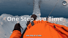 a person in an orange jacket with the words one step at a time underneath them