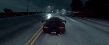 a car is driving down a highway at night with a license plate that says ' jcw ' on it