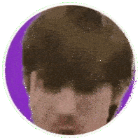a close up of a man 's face in a circle .