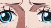 a close up of a person 's eyes with blue eyes