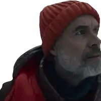 a man with a beard wearing a red beanie and a red jacket