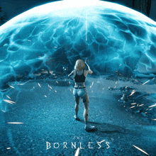 a woman is standing in front of a large blue sphere with the words the bornless on it