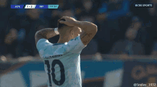 a soccer player with the number 10 on his shirt