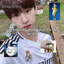 a young boy wearing a white adidas shirt is sitting on a bench