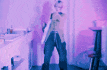 a blurry picture of a person standing in a room
