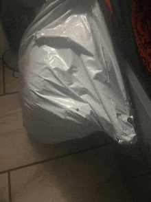 a white plastic bag with a hole in it