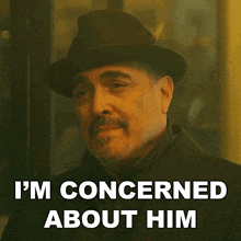 a man wearing a hat and a coat says i 'm concerned about him