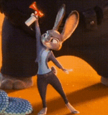 a cartoon rabbit is standing on a yellow surface holding a megaphone .