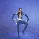 a woman in a blue superhero costume is dancing on a blue background .