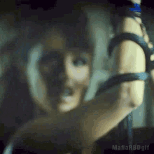 a blurry picture of a woman with the words mafia rbdgif on the bottom right
