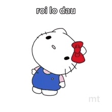 a hello kitty sleeping on a bed with the words giac mo below her