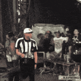 an animated image of a referee with kapwing in the bottom right corner
