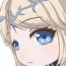 a close up of a girl 's face with blue eyes and antlers on her head