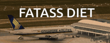 a singapore airlines airplane is parked on the tarmac