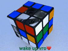a picture of a rubik 's cube with the words wake up vro written on it