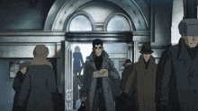a group of people are standing in front of a door