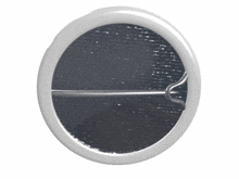 a white circle with a pin in it