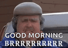 a man is wearing a hat and ear muffs and says good morning
