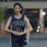 a girl wearing a jersey that says nypdx on it
