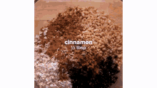 a glass bowl filled with oats cinnamon and rice