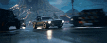 a car is driving down a road with a mountain in the background and a sign that says no parking