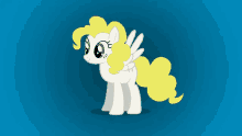 a white pony with a yellow mane and tail