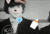 a picture of a man with a pacifier and a bottle with the words hello world on it