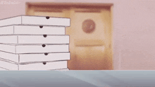 a shark girl is standing in front of a pile of pizza boxes .