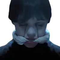 a woman with a scarf around her neck has a tear running down her face
