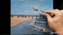 a person is painting a picture of a beach with the words made in animotica below