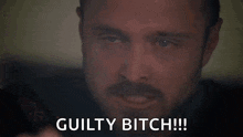 a close up of a man with a beard saying `` guilty bitch '' .