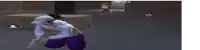 a man in a blue hoodie and purple pants is kneeling down in a video game .