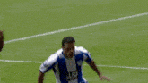a soccer player with the number 8 on his jersey is laying on the ground