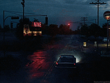 a car is driving past a canine restaurant