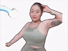 a woman with a tattoo on her arm is being attacked by a blue tentacle
