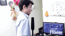 a man singing into a microphone in front of a computer screen that says " made with flixier "